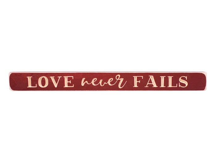 Sign-Engraved-Love Never Fails-Cherry (1 3/4 x 18)